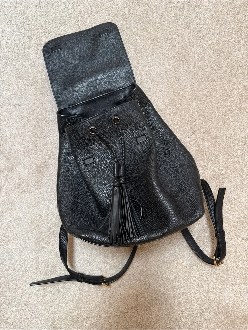 Tory Burch Black Pebbled Leather Tassel Flap Backpack